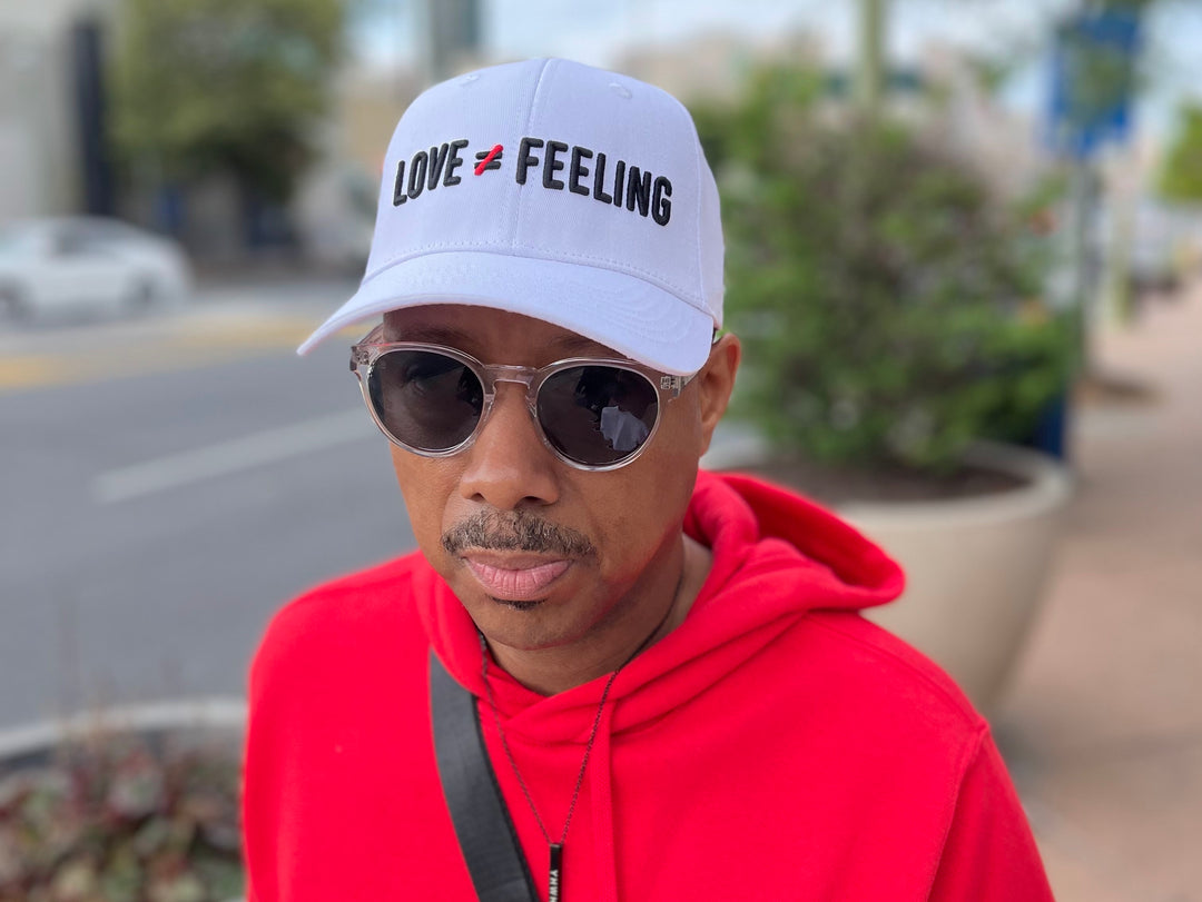 Love is Not a Feeling Cap - White
